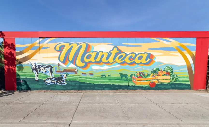 Mural depicting Manteca’s agricultural and dairy heritage near Security Public Storage on E Lathrop Rd in Manteca, CA