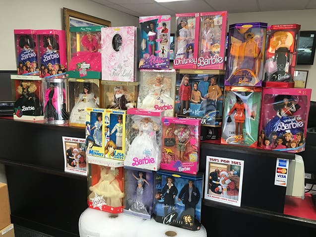 A large pile of donated Barbie dolls