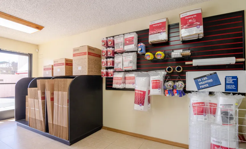 Boxes, locks, and moving supplies available for purchase inside the storage facility