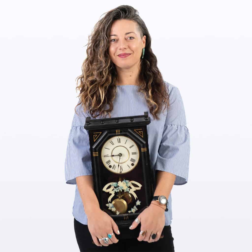 Girl holding clock