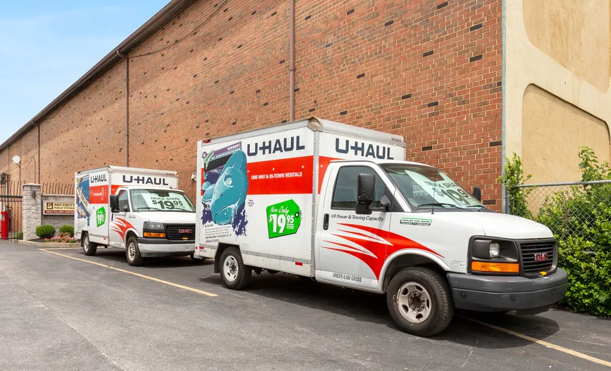 Moving trucks parked outside the storage facility and ready for customers to rent