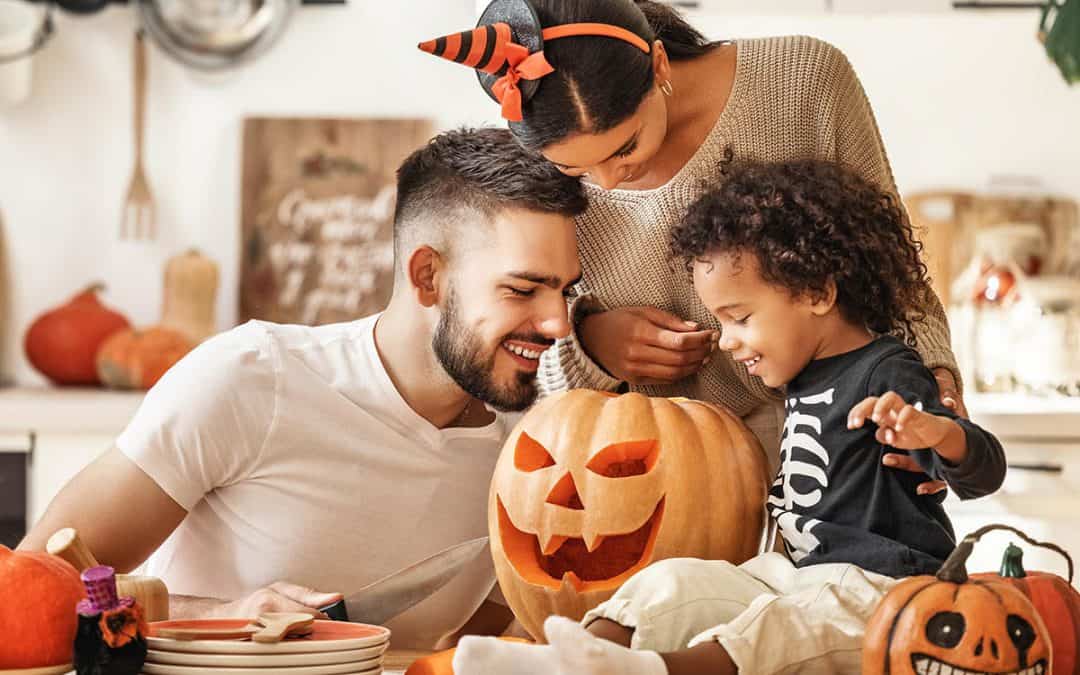 family carving pumpkins