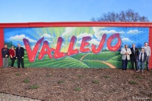 Vallejo team in front of mural