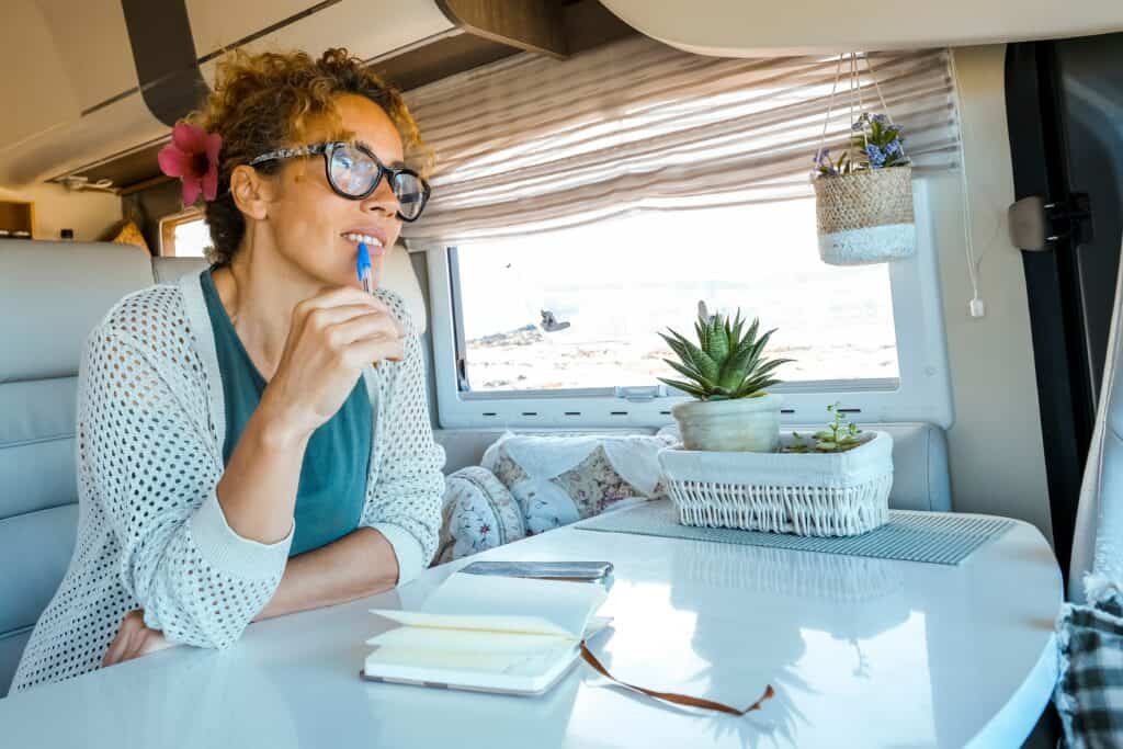 woman-reading-and-writing-in-camper