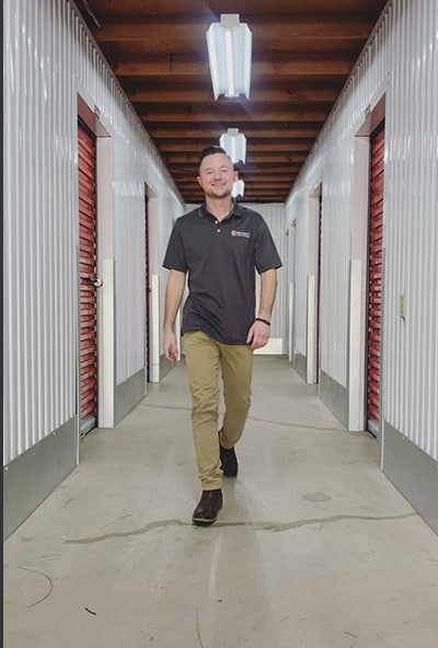 young man assists with storage